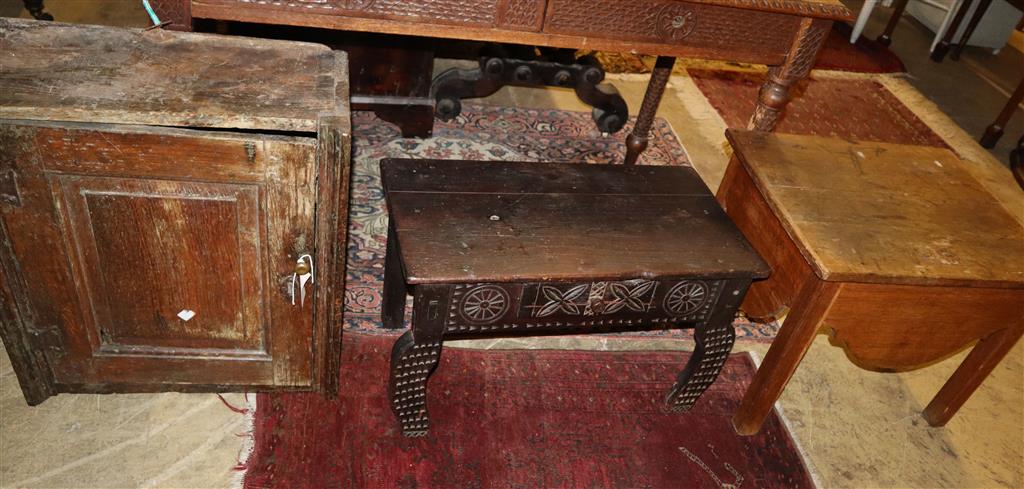An 18th century oak wall cabinet, width 55cm, depth 28cm, height 61cm together with a commode and chip carved bow table